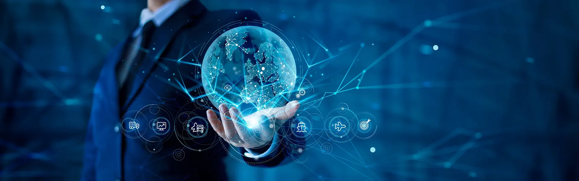 The businessman is holding a digital sphere filled with icons in his hand