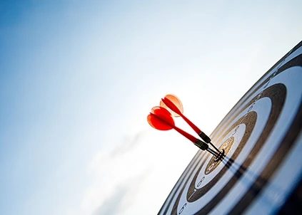 The moment when two darts hit the target board