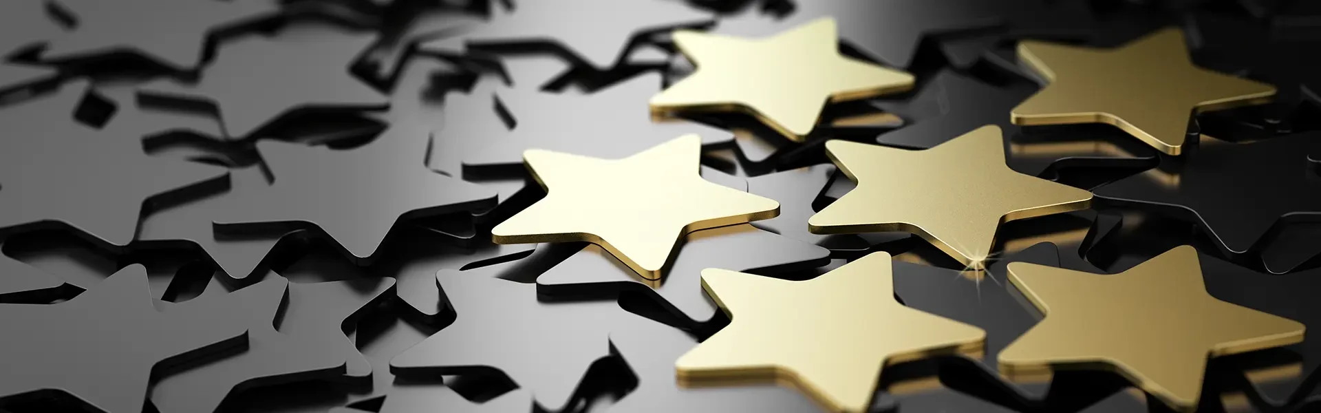 Shining gold stars on a black background