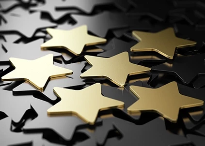 Shining gold stars on a black background
